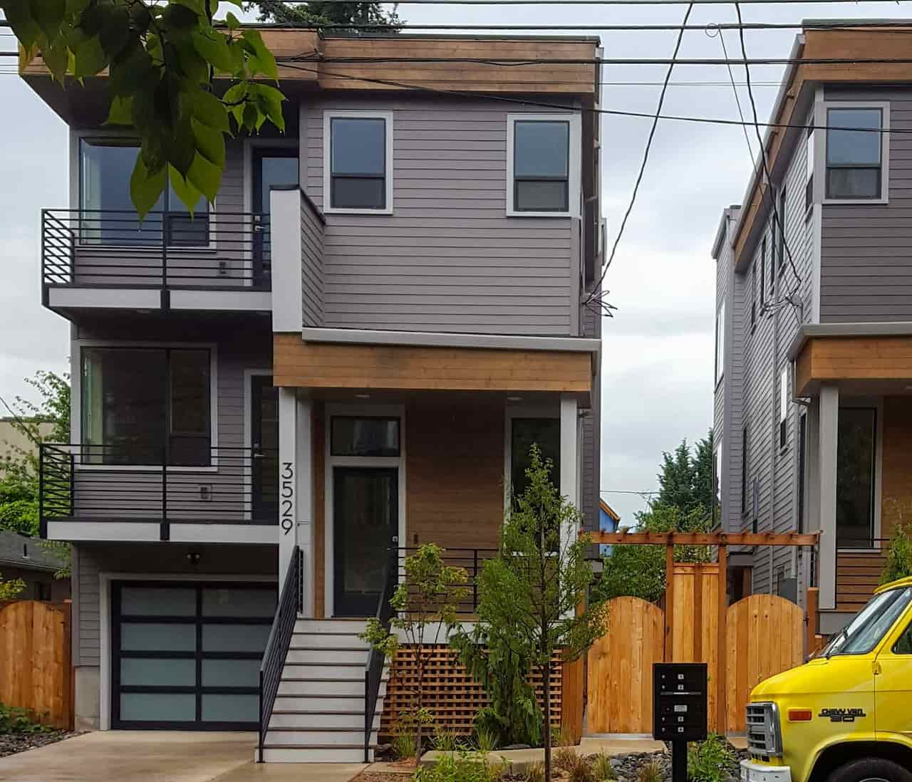 3 story home with small tree